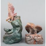 A carved soap stone figure group of an eagle with snake 9"h and a carved hardstone figure of a an