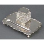 A silver inkstand with pen tray and a lidded cut glass inkwell Sheffield 1927, 7 1/2"