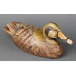 A reproduction carved and painted wooden decoy duck 13"