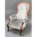 A Victorian mahogany show frame armchair upholstered in blue buttoned material, raised on cabriole