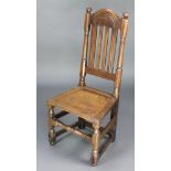 A 17th/18th Century stick and bar back hall chair with solid seat raised on turned and block