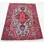 A red and blue ground Bakhtiari rug with central medallion 90" x 62" There are signs of wear