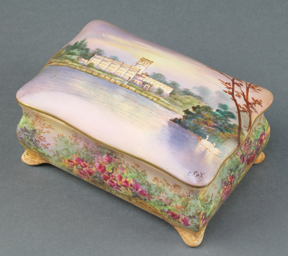 A Crown Devon trinket box decorated with a view of a country house, signed C Cox 6"