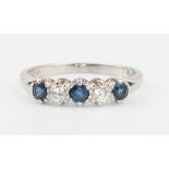 An 18ct white gold sapphire and diamond ring size Q