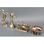 A copper and brass model of a barrel raised on stillage 2" x 4", a gilt metal model of a bullock,