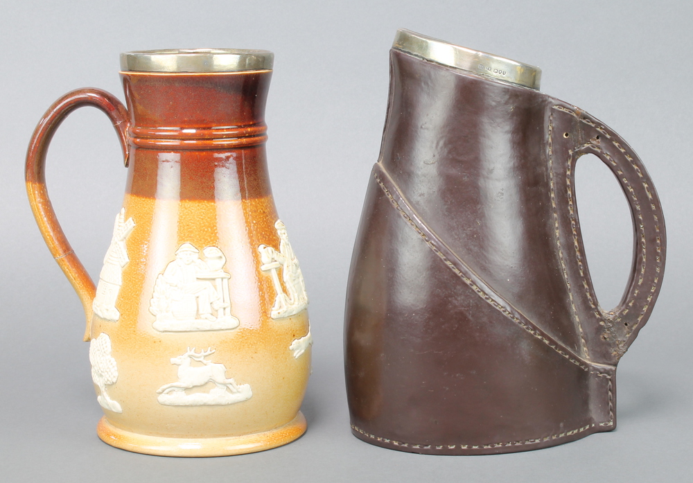 A Doulton Lambeth leatherwork jug with silver collar London 1891 9" and a stoneware jug with