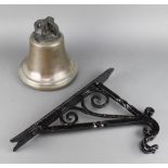 A bronze bell 9" together with an associated iron bracket 17 1/2"