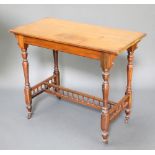 A Victorian rectangular walnut centre table raised on turned supports with H framed stretcher and