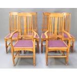 A set of 6 oak Art Nouveau Liberty style stick and rail back dining chairs, the seats raised on