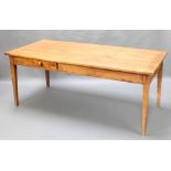 A 19th Century rectangular French cherry dining table fitted 2 drawers, raised on square tapering