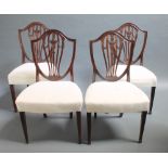 A set of 4 19th Century Hepplewhite style mahogany shield back dining chairs with pierced vase