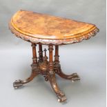 A Victorian carved and figured walnut card table, raised on 4 turned supports with splayed feet 28"h