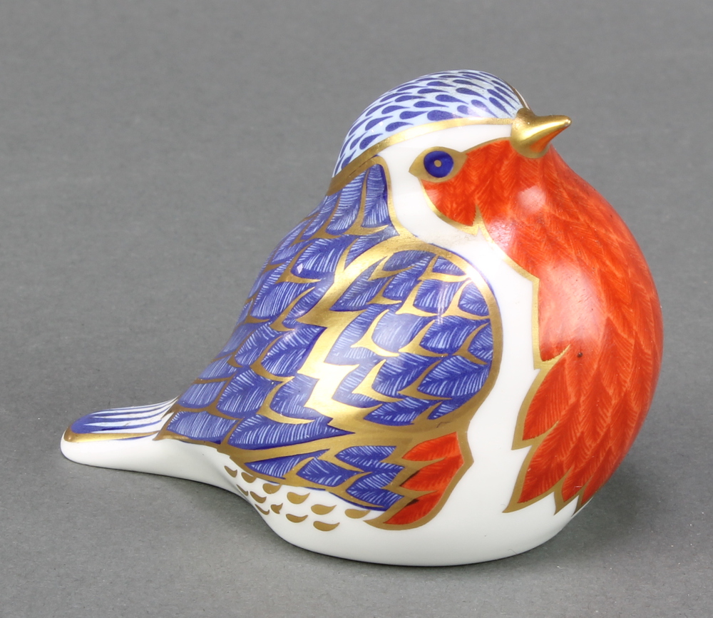 A Royal Crown Derby paperweight in the form of a robin with silver stopper 2 1/2"