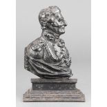 A Victorian cast iron door stop in the form of the profile of the Duke of Wellington, indistinct