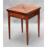 An Edwardian mahogany envelope card table fitted a drawer raised on square supports 27"h x 21"w x