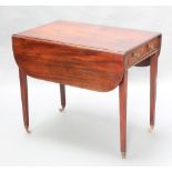 A 19th Century mahogany Pembroke table fitted a drawer and raised square tapered supports, brass