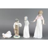 A Nao figure of a boy holding a football 7 1/2", a ditto of a girl 8", another of 2 geese 4" and a