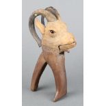 A pair of 19th Century Black Forest nut crackers in the form of a goat 7" One horn is stuck