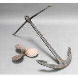 A Fisherman's iron anchor 39" x 39" together with a bronze 3 bladed propellor 16"