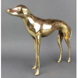 A polished brass figure of a standing dog 14"