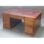 A mahogany partners desk with inset red leather writing surface, fitted 2 long and 2 short