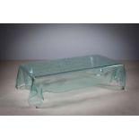 A HEAVILY SHAPED GLASS COFFEE TABLE, 1970s, ITALIAN, PROBABLY MURANO, 130cm (w) x 70cm (d) x 35