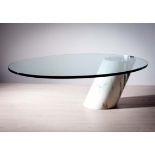AN OVAL ELIPTICAL COFFEE TABLE, BY CINI BOERI, the thick glass top on a cantilever marble plinth