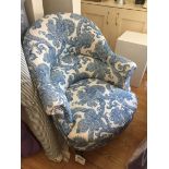 AN UPHOLSTERED BEDROOM CHAIR, upholstered in blue Chanee Ducrocq fabric