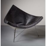 THE COCONUT CHAIR, BY GEORGE NELSON FOR VITRA, in black, on tubular tapering legs, bearing label.