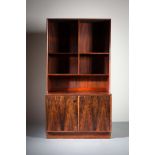 A ROSEWOOD UPRIGHT BOOKCASE, DANISH, with open shelving, the base with two cupboard doors, 100cm (w)