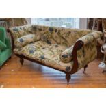 A MAHOGANY FRAMED REGENCY STYLE GRECIAN SOFA, upholstered in Bernard Thorpe tapestry, with scrolling