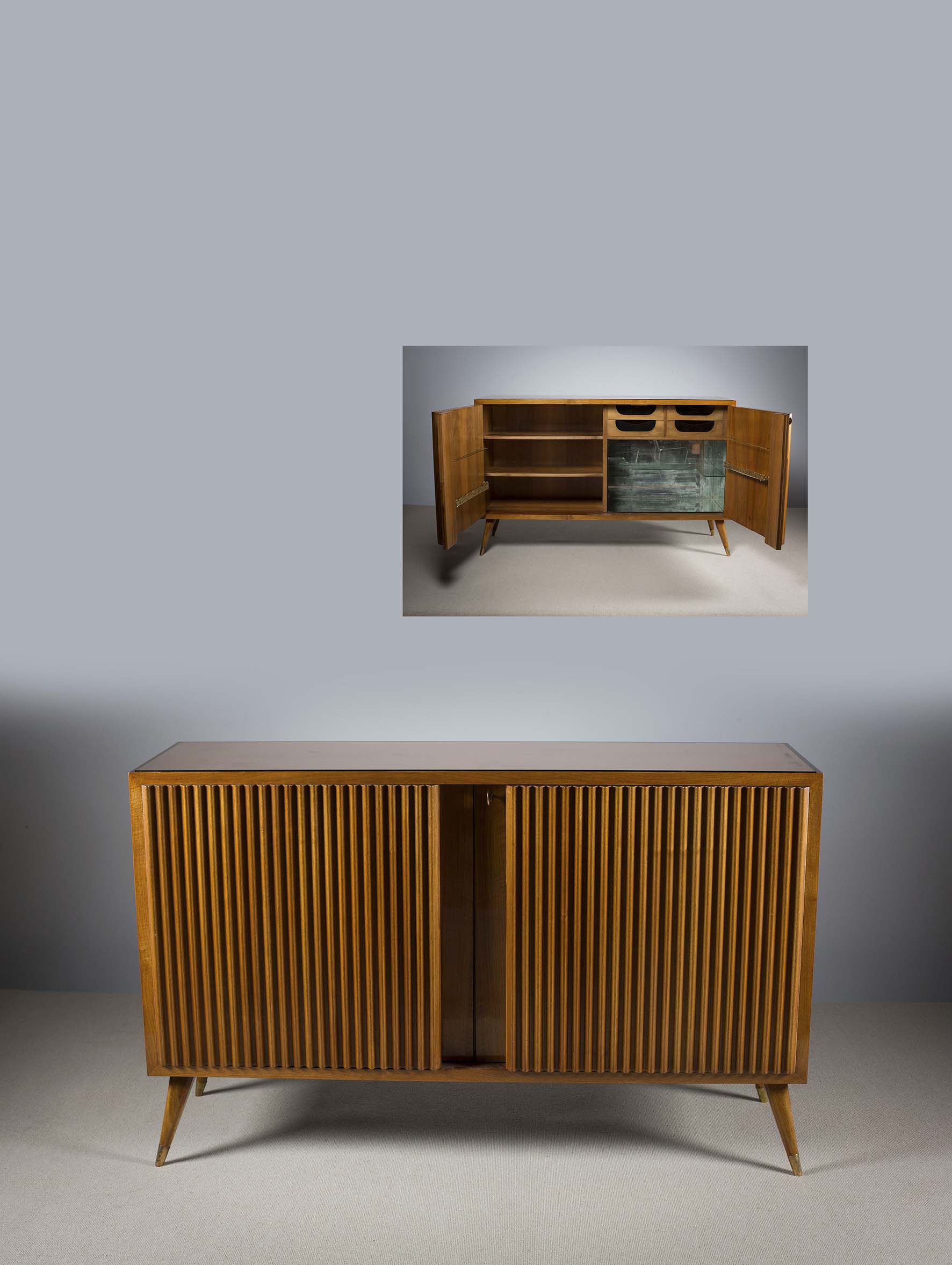 A FINE WALNUT SIDE CABINET, ITALIAN 1950s, with double ribbed doors, revealing a fitted interior, on