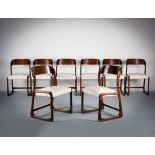 A SET OF TEN DINING CHAIRS, FRENCH 1970s, with rounded tablet backs, on shaped supports. (10)