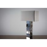 A SQUARE CHROME TABLE LAMP, French 1970s, on angular supports, check siz....