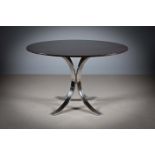 A WALNUT VENEERED CIRCULAR DINING TABLE, raised on a splayed chrome base, 120cm diam x 73cm (h)