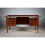 A TEAK KNEEHOLE DESK, DANISH, BY PETER LOVIG NIELSEN FOR DANSK DESIGNS, DENMARK, with a pair of