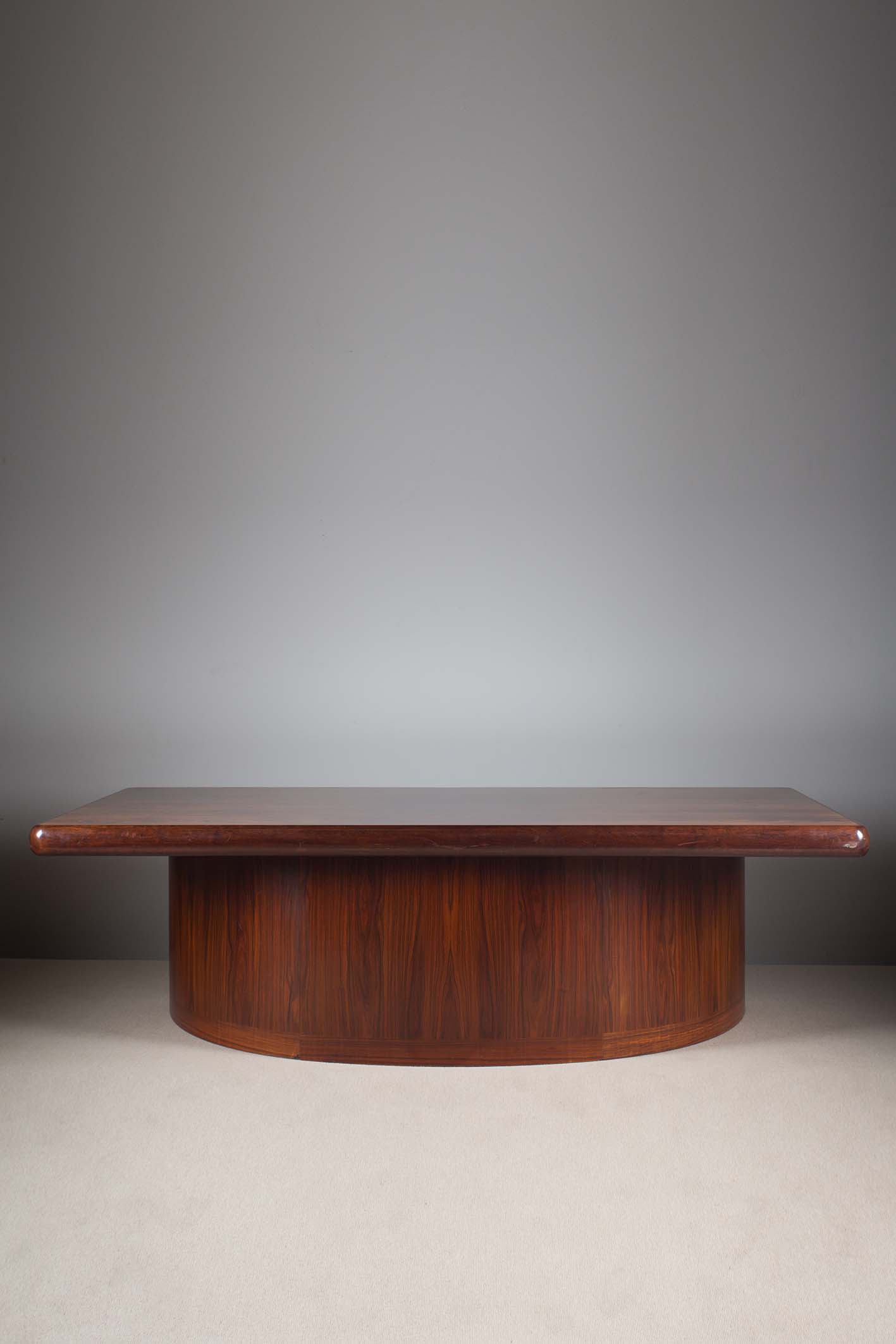 A LARGE ROSEWOOD EXECUTIVE DESK, DANISH 1960s, BY DYRLUND, the rectangular top containing three pull