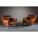 A PAIR OF BROWN LEATHER AND ROSEWOOD FRAMED LIBRARY CHAIRS, DANISH, with matching footstool (3)
