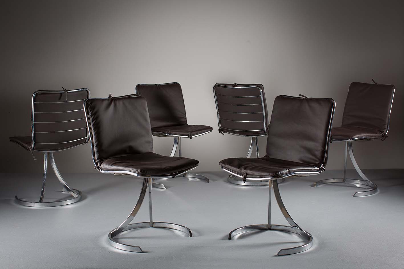 A SET OF SIX CHROME DINING CHAIRS, ITALIAN, 1960s, with railed backs on shaped support. (6)
