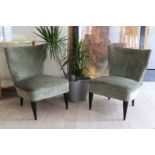 A PAIR OF UPHOLSTERED LOW TUB CHAIRS, on