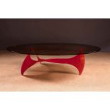 A RED PROPELLER TABLE WITH OVAL SMOKED G
