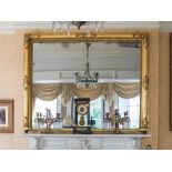 A GILTWOOD AND PLASTER OVERMANTEL OF LAR