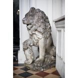 A PAIR OF STONE ARMORIAL LIONS, on plint