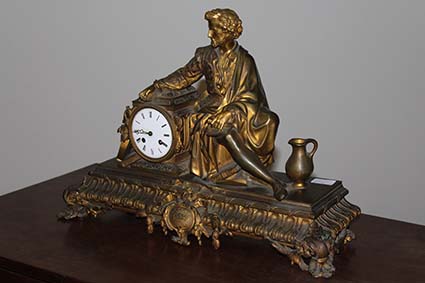 A GILT BRASS FIGURAL MANTEL CLOCK, 19th