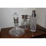 A SILVER TOPPED CUT GLASS SHIPS DECANTER