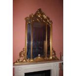 A GILTWOOD UPRIGHT COMPARTMENTED MIRROR