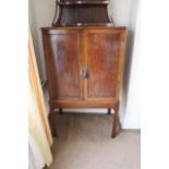 A mahogany upright cabinet, early 19th C