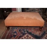 A RECTANGULAR UPHOLSTERED FOOT STOOL, on