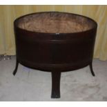 A STAINED WOOD OVAL COOPERED FUEL CONTAI