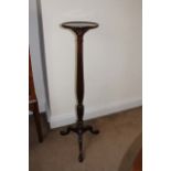 A mahogany torchere, 19th Century, with